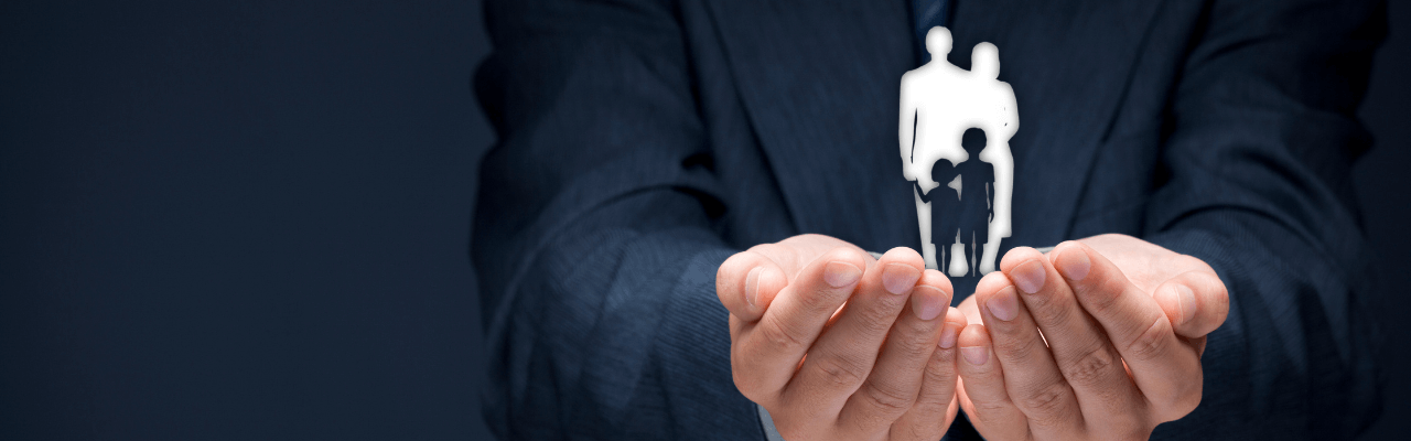 Business professional reviewing documents with a team in the background, highlighting the strategic benefits of a family office for wealth planning and governance.