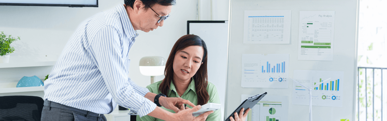 Team collaborating on financial reports during the finance month-end closing process in a modern office setting